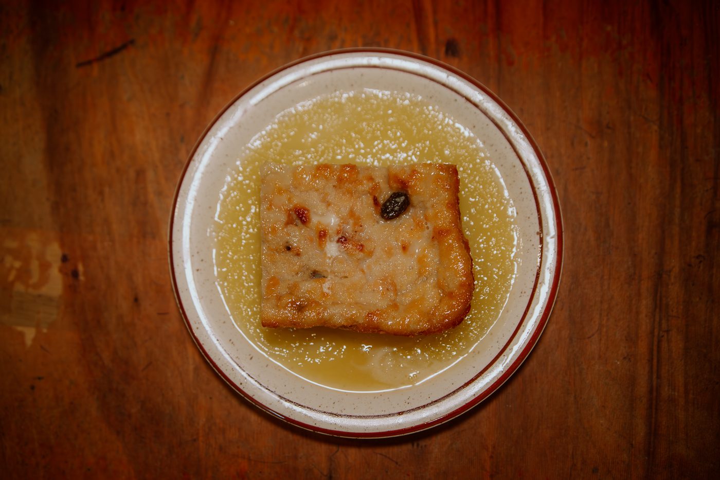 Bread pudding smothered in warm bourbon sauce